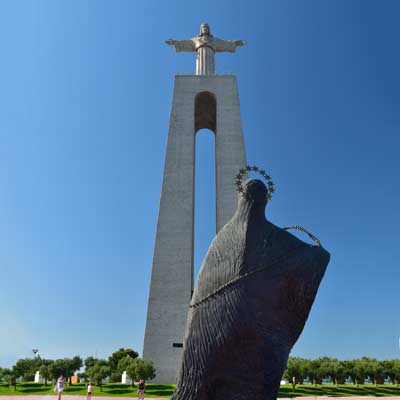 Image result for Cristo-Rei (Christ the King) monument overlooking Lisbon.