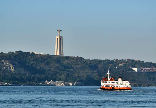 Cristo Rei statue lisbon and ferry